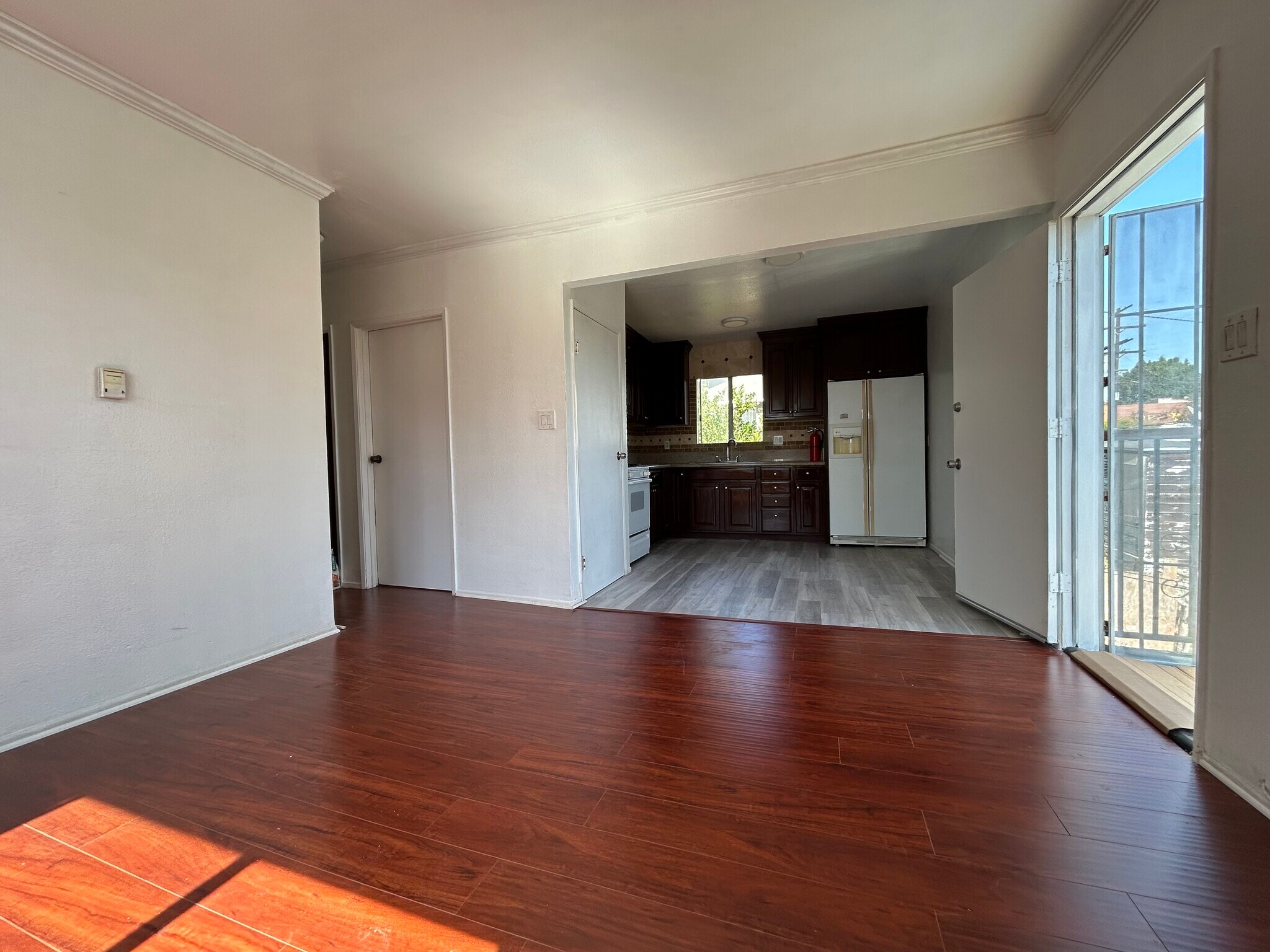 View from living room to kitchen and door to outside - 1156 N Chicago St