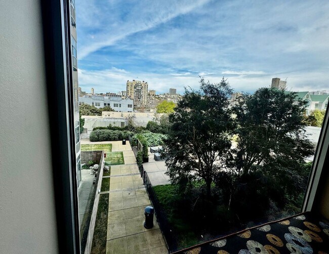 Building Photo - Corner Light. City Energy. Zero Compromise.