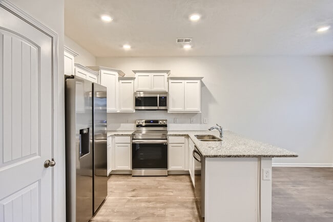 Building Photo - Move-In Special! 3 Bed/3 Bath Townhome with Garage / Pet-Friendly / Available Now!