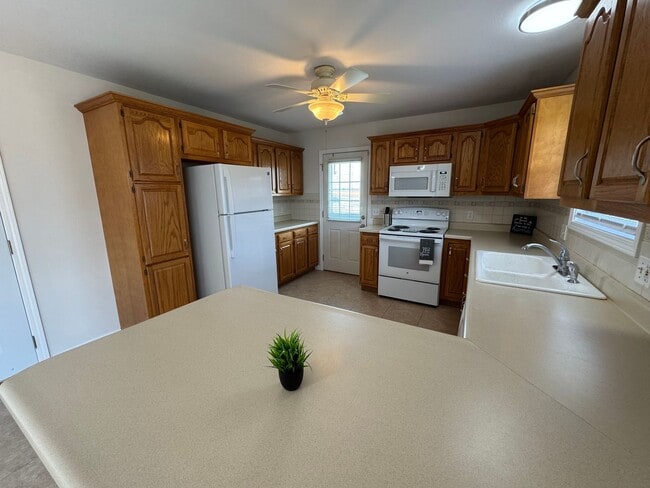 Building Photo - 4 Bedrooms, Big Yard & Top Schools – Don’t...