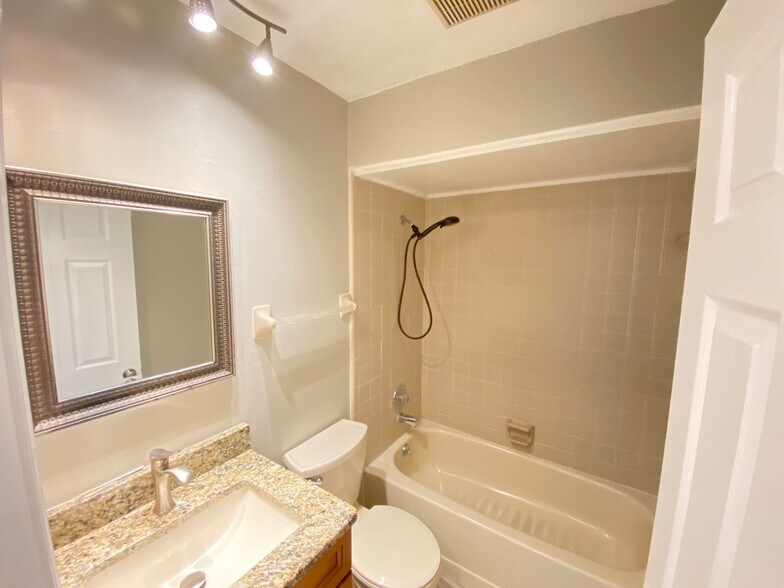 Building Photo - 2/2 home with garage - tile on inside with...