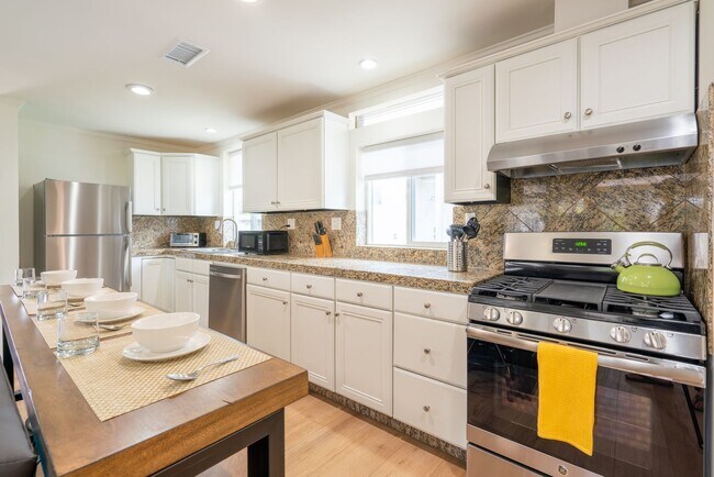 Building Photo - Enjoy stunning sunsets and beach living at its finest, Short Walk to Beach