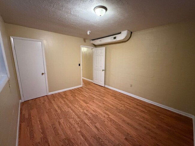 Building Photo - Updated 4BR Home with Finished Basement & Level Yard