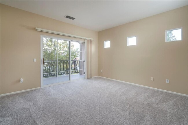 Building Photo - IMMACULATE 2+2 VALENCIA TOWNHOME!