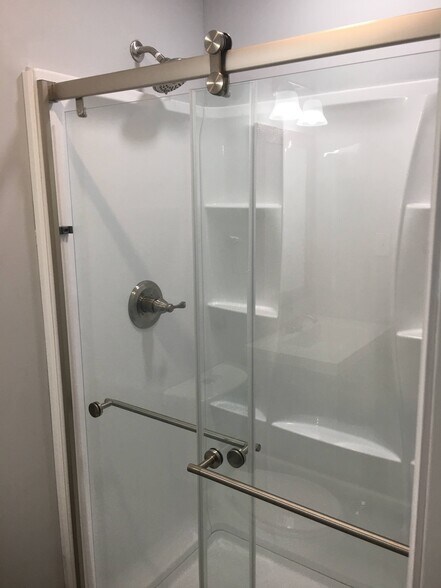 Master bathroom includes clean and sleek stand-up shower. - 12 Mill Street