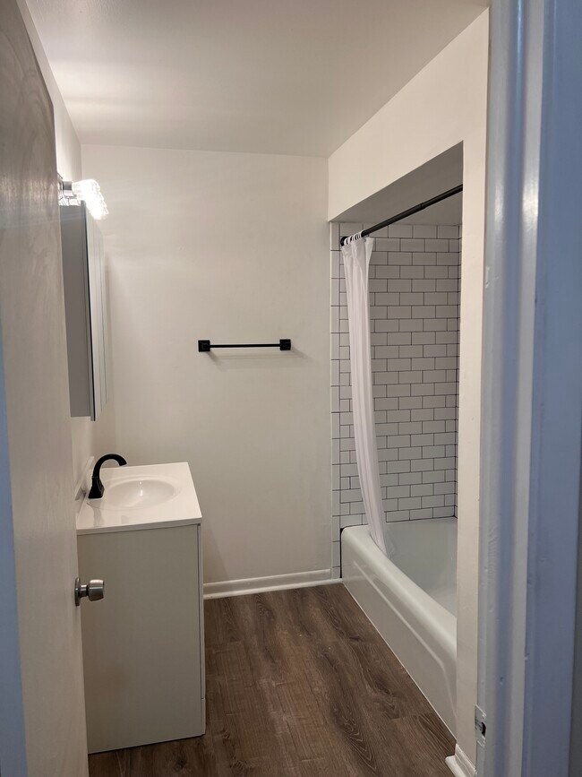 Spacious bathroom. New Laminated Flooring. - 7220 Madison St