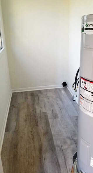 laundry room with new HWH - 311 N Crater Rd