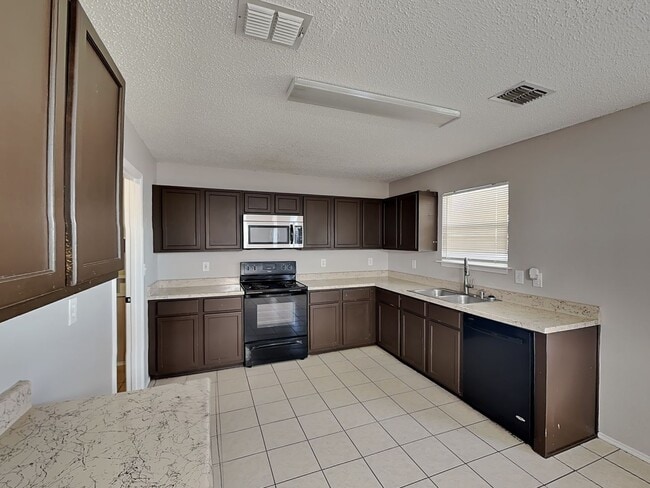 Building Photo - Corner Lot Charmer with Two-Story Deck and Bonus Game Room!