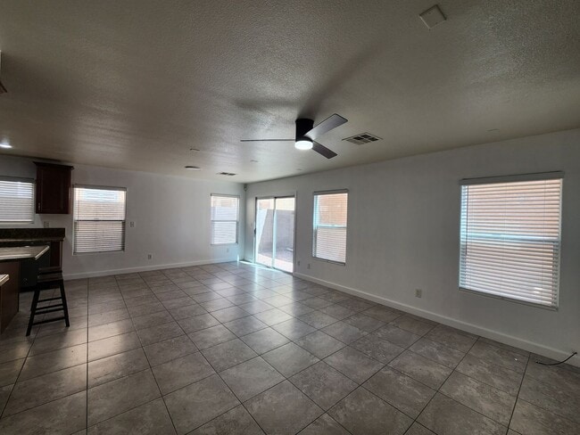 Building Photo - Sleek 2 story home with tile in most living areas and upgraded kitchen.