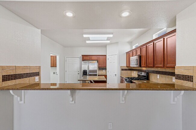 Building Photo - "Spacious 4-Bed Oasis with Granite Touches...