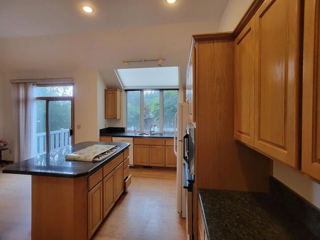 Building Photo - Spacious 3-Bedroom Home with Den and Priva...