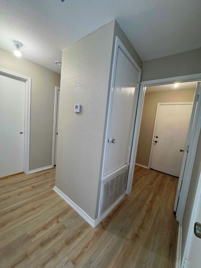 Building Photo - NEW PAINT, FLOORING, APPLIANCES & ROOF  | ...