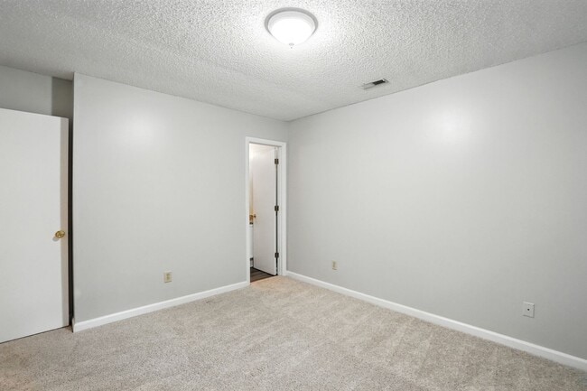Building Photo - Spacious 2-Bedroom, 2.5-Bath End-Unit Town...