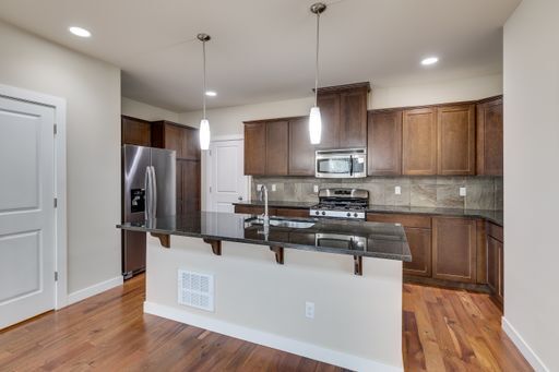 Building Photo - Mill Creek Townhome with 2 Car Garage Available Now!