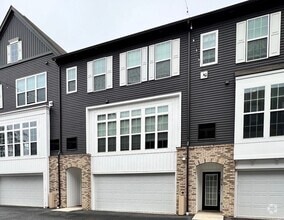 Building Photo - 2-bedroom 2.5 bath Luxury Townhome located...