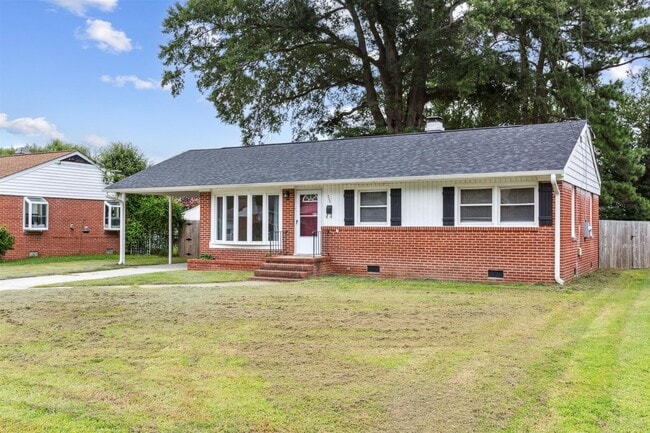 Building Photo - Charming brick rancher with modern kitchen...