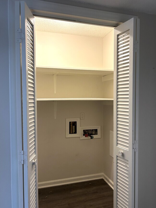 Laundry room with washer/dryer hook ups and extra storage - 219 H Northpoint Avenue
