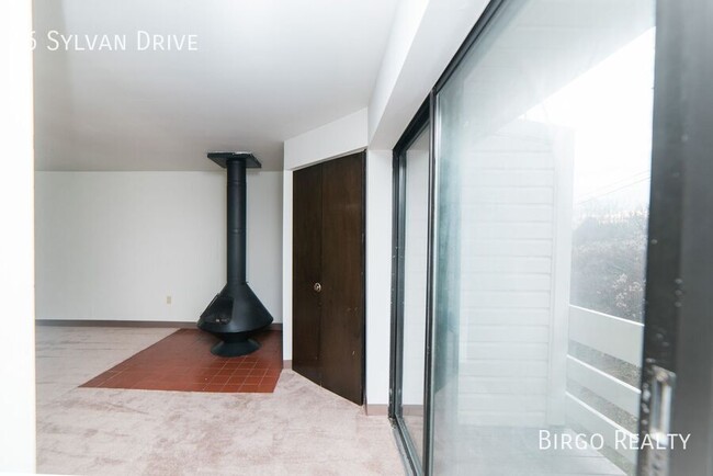 Building Photo - Warm up next to the fire in this 2 bedroom...