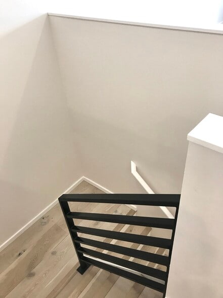 Stairs down to the bedroom level - 4253 Palatine Ave N
