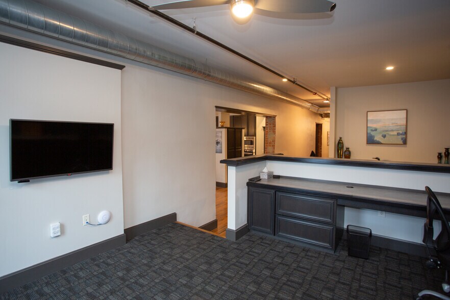 Office with flatscreen on E wall - 225 E Blaine Ln
