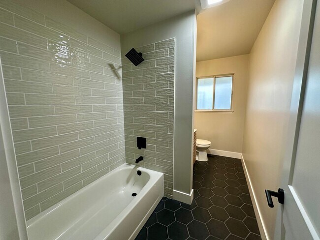 Building Photo - 1/2 Month Free! Sun-Filled 3-Bedroom Ranch with Wood Flooring, A/C, Updated Kitchen & 2-Car Garage!