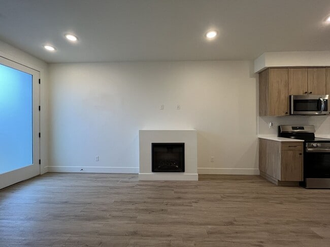 Building Photo - Modern 2-Bed, 1.5-Bath Condo with Custom Kitchen, Private Patio, and Prime Location