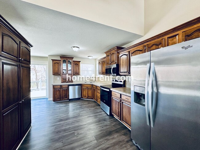 Building Photo - Spacious Four Bedroom Northland Home with a Finished Basement, 3 car garage and Fenced Yard!