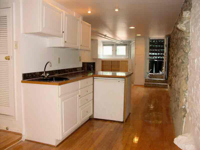 Kitchenette with living room beyond - 3118 Dumbarton St NW