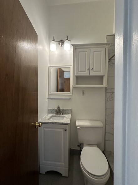 Bathomm 2: Full bathroom with shower, marble, stone, modern - 2329 W Grace St