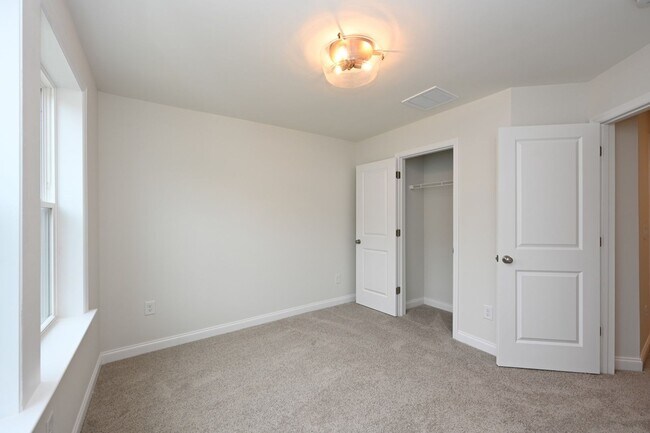 Building Photo - **BE THE LUCKY ONE TO LIVE IN THIS 2024-BUILT TOWNHOME**