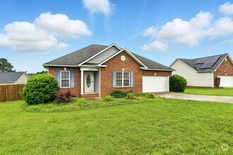 Building Photo - Charming 3BR Brick Home with Private Yard ...