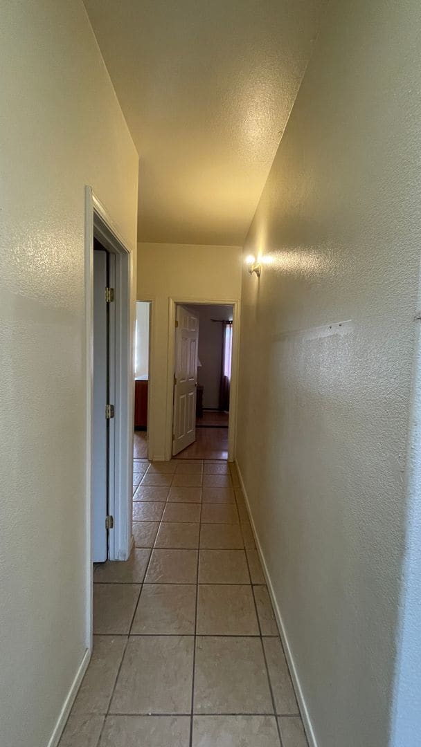 Building Photo - Modern town home with AC. 3/2. Covered, off-street parking, easy care yard.  Ample kitchen. Lamin...