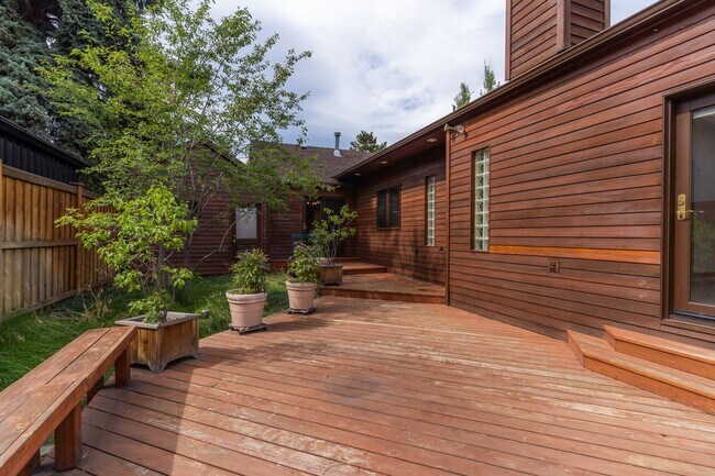 Building Photo - Private river access and stunning views from this home on Harmon Blvd! + Bonus Room