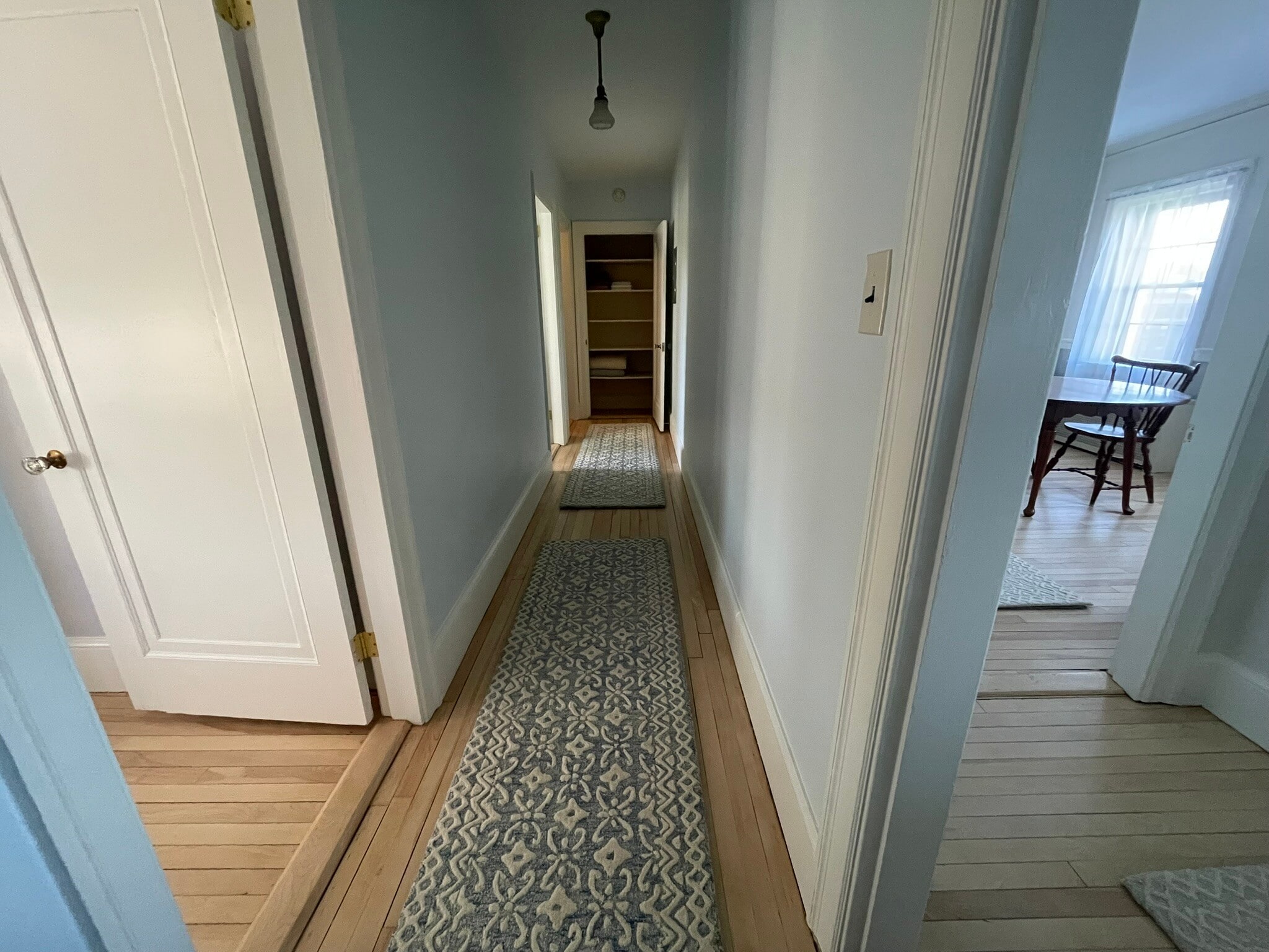 Hallway, with bedrooms to the left and living & dining room to the right - 11 Ricker Park