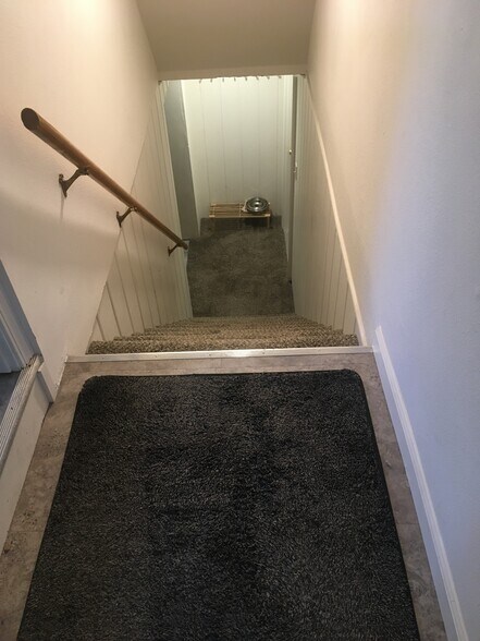 stairway to apartment - 103 W 30th Ave