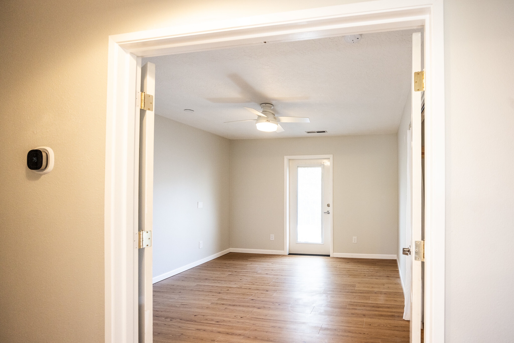Bedroom #1. French doors, ceiling fan - 8717 NE Webster St