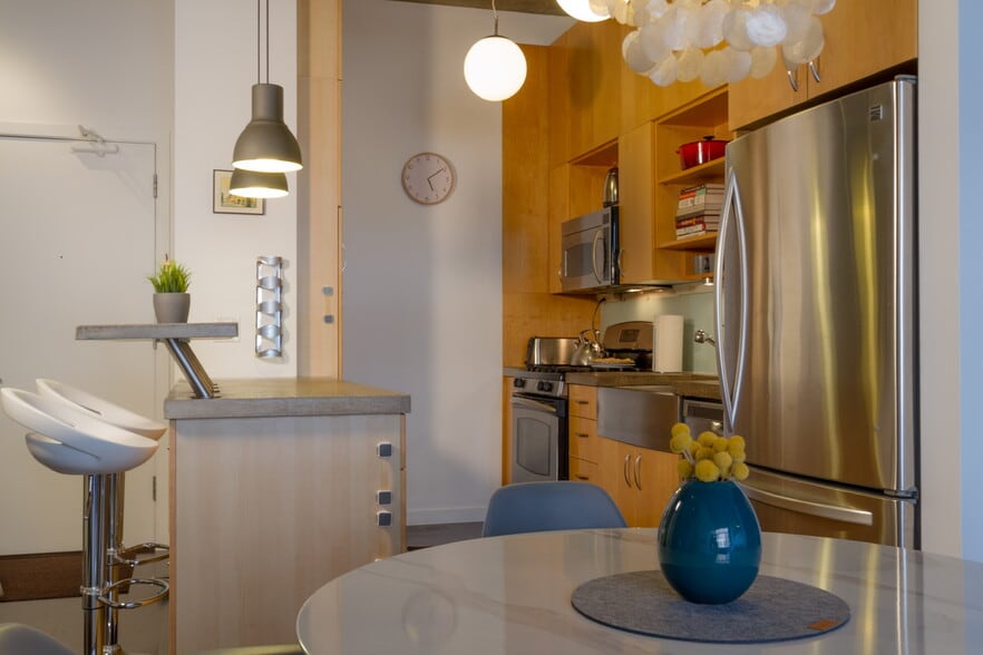 Kitchen with bar-top seating - 1255 NW 9th Ave