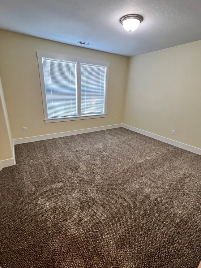 Building Photo - Remodeled Home with New Flooring, Quart Counters, W/D, Fenced Yard, Parking & MORE!