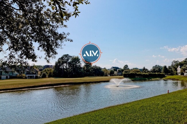 Building Photo - Charming First-Floor Condo with Pond Views at The Estate at Westbury
