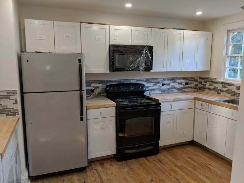 Very well lit and brand new cabinets, counters and backsplash! Beautiful kitchen! - 1111 Watauga St