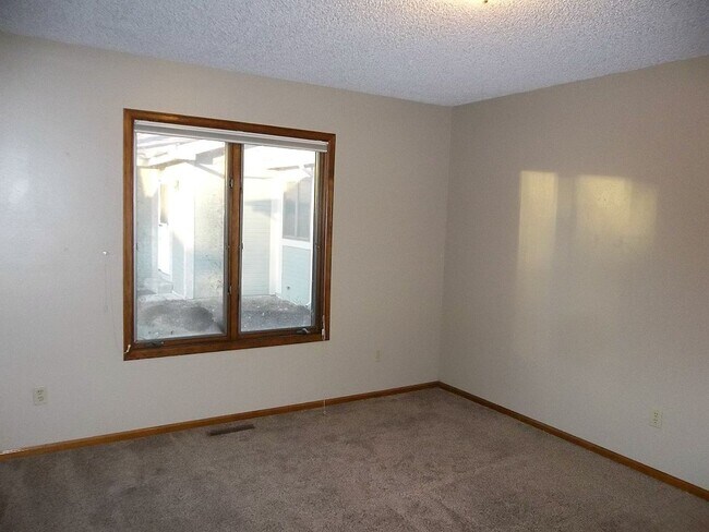 Building Photo - $500 OFF First Month | Charming 2BR Townhome with Garage