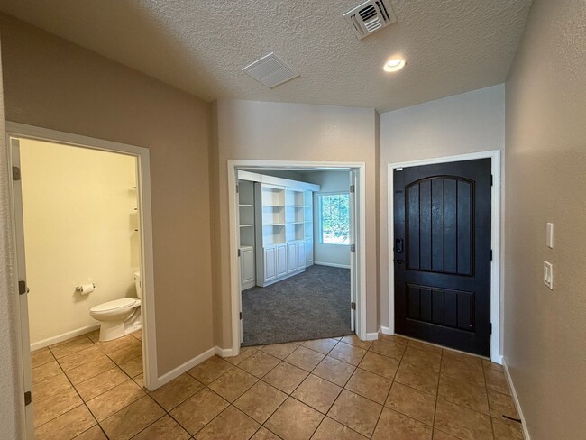 Building Photo - 4 Bedroom + Office Home Available Near Loma Colorado Blvd NE & Broadmoor Blvd NE in Rio Rancho!