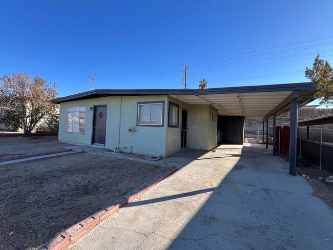 Building Photo - 3 Bedroom House with New Paint, Wood Floor...