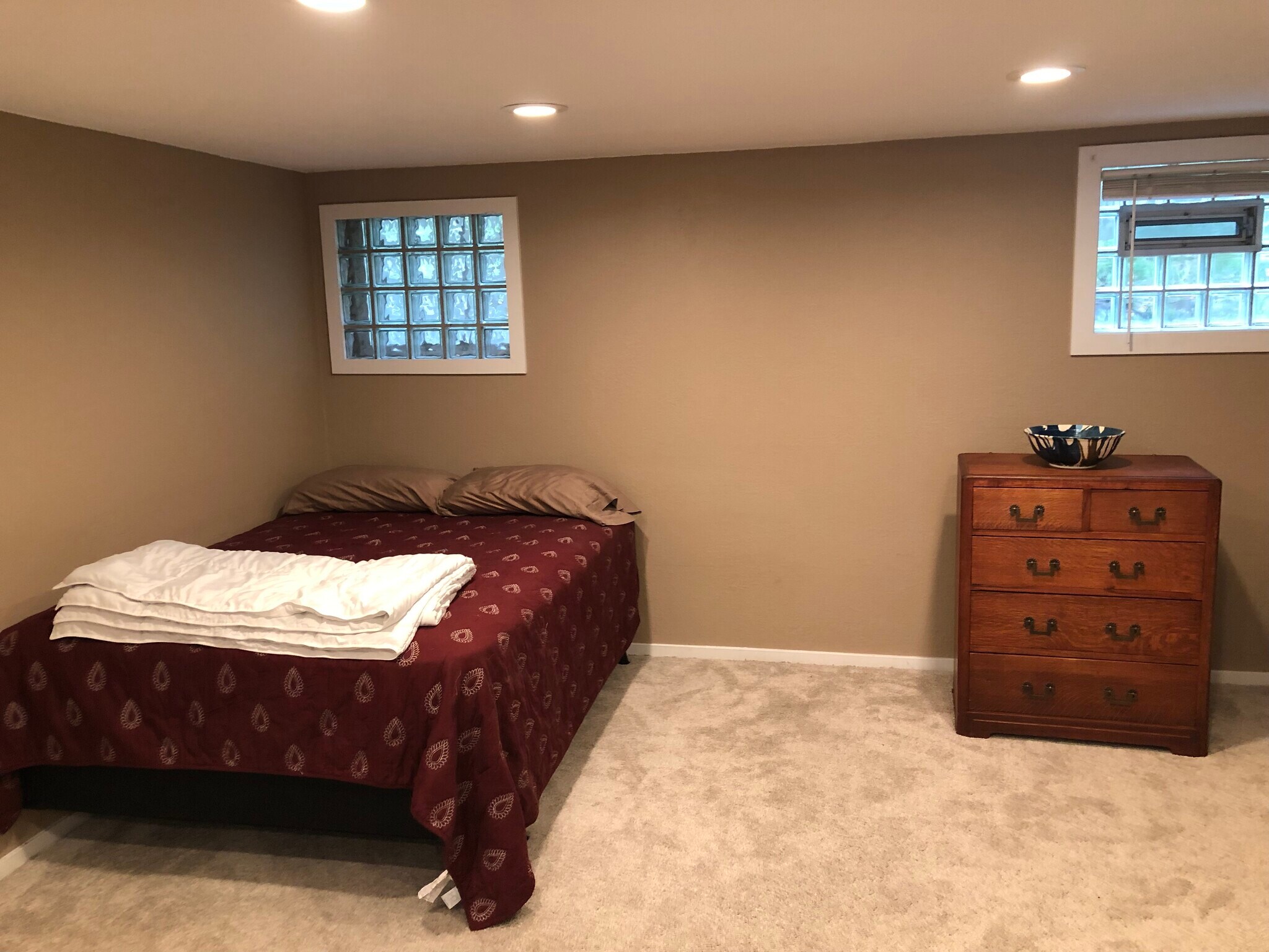 Bed, bedding, and bureau. - 17405 Ashworth Ave N