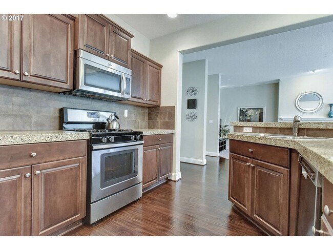 Building Photo - Bright and Open Floor Plan with Fireplace, Attached Garage & Vaulted Ceilings