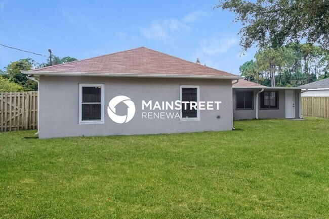 Building Photo - 4 Bedroom Pet-Friendly Home in Palm Bay, FL with Main Street Renewal