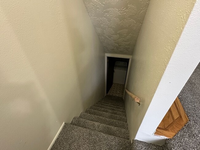 Building Photo - Spacious, three level, 4 Bed 2.5 bath Townhome in Ammon right behind the Walmart on Hitt.