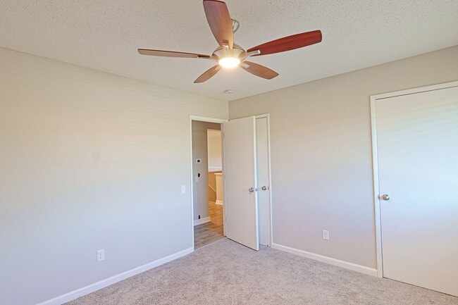 Building Photo - Spacious 3-Bedroom Attached Villa with Finished Basement & Private Fenced Yard!