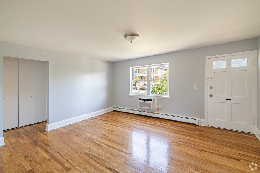 1BR, 1BA - 645SF - Living Room - Station Square Apartments – Modern Living with Parking Included