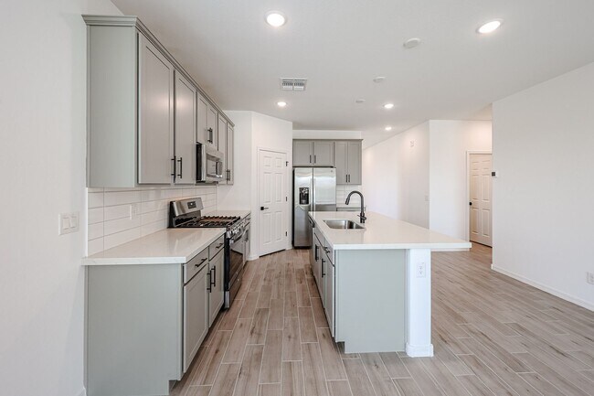 Building Photo - Modern Mountainside Living: Stunning New 4-Bedroom Home in Estrella Crossing! 3 CAR GARAGE!